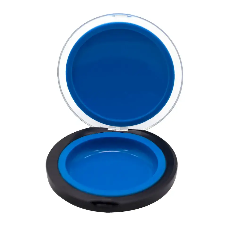 open blue clamshell puck