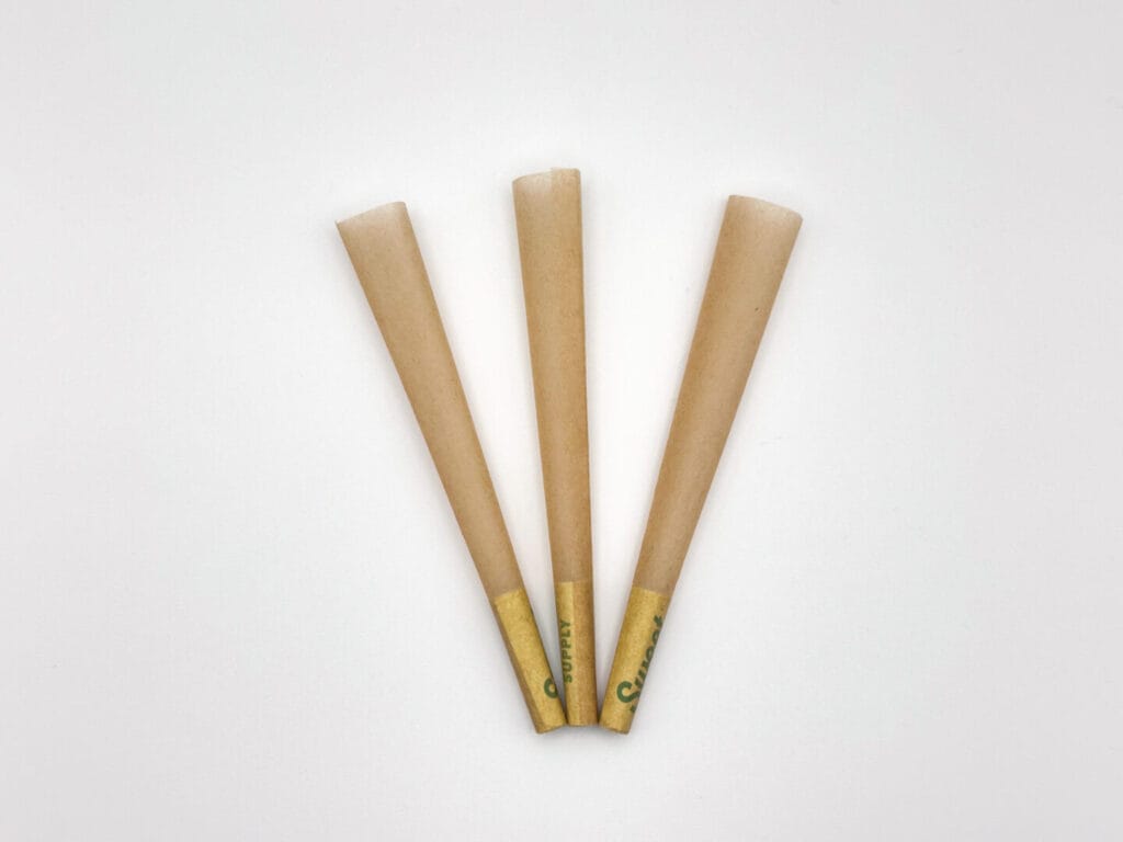 three unbleached pre-roll cones