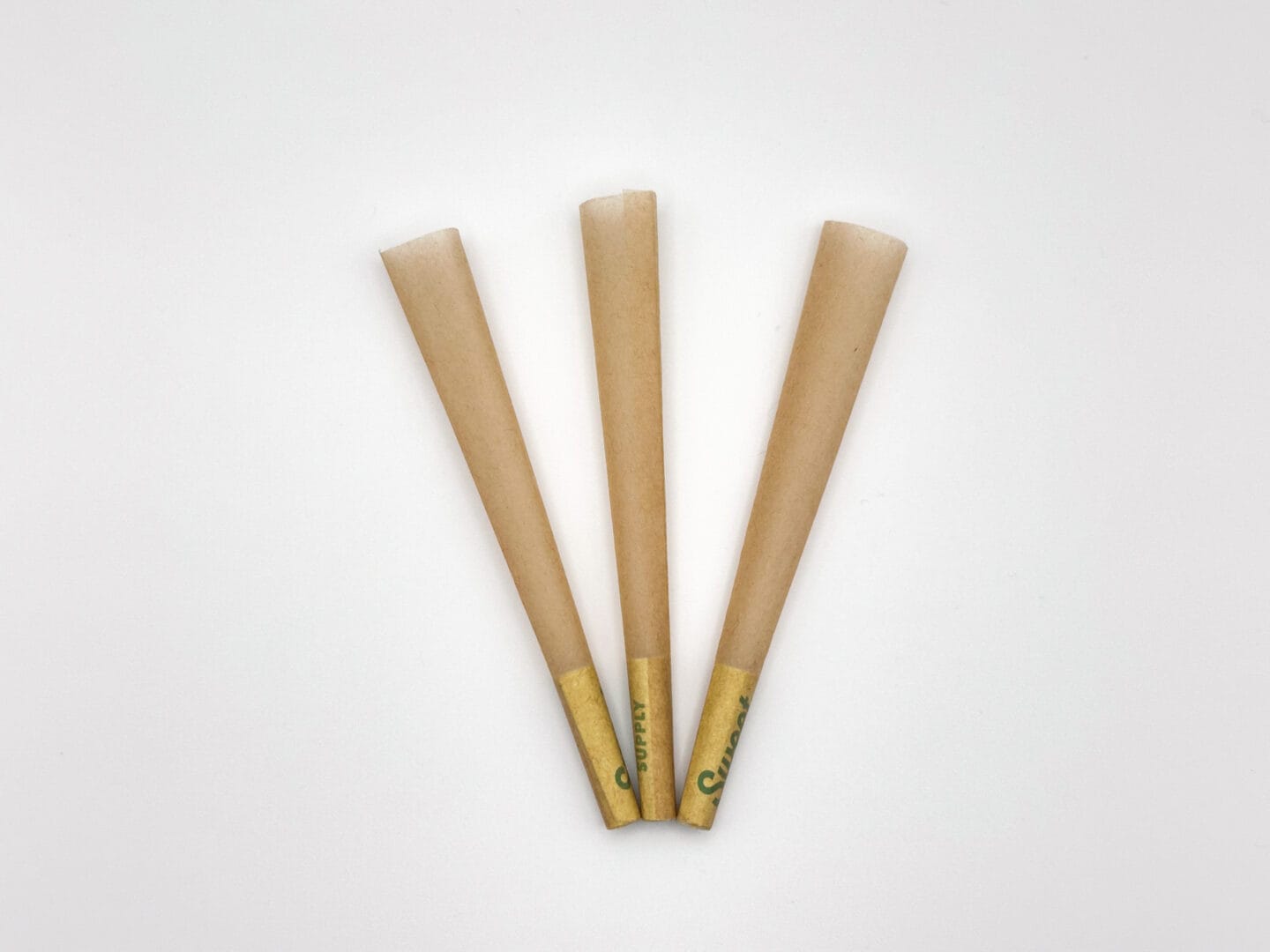 three unbleached pre-roll cones