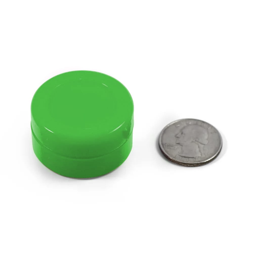 green silicone puck with quarter to show size
