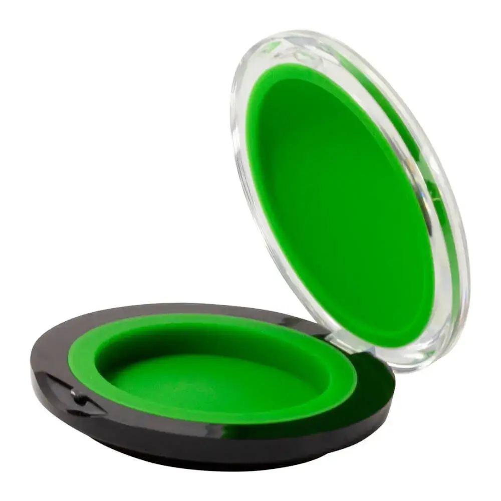 open green clamshell puck