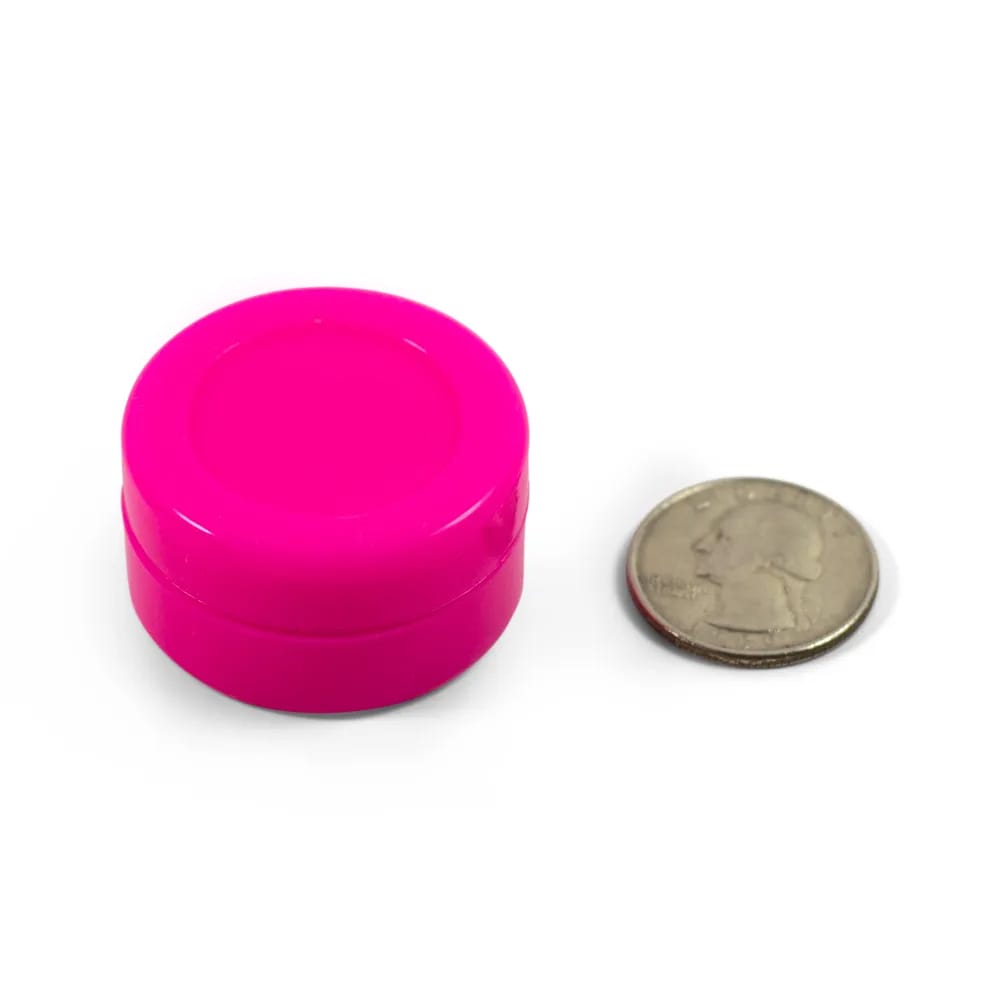 pink silicone puck with quarter to show size